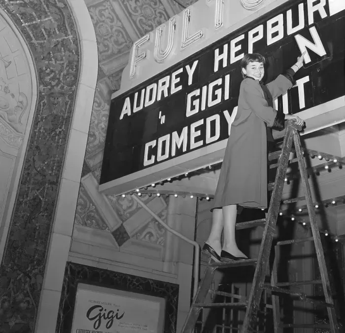 Framed Print : Audrey Hepburn Placing Letters on Marquee Framed Print : Audrey Hepburn Placing Letters on Marquee