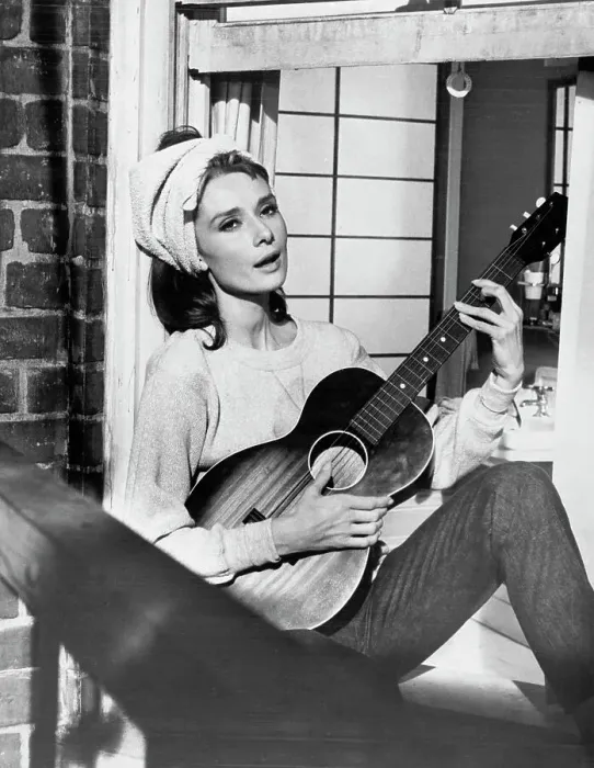 Framed Print : Audrey Hepburn Playing Guitar in Breakfast at Tiffany's Framed Print : Audrey Hepburn Playing Guitar in Breakfast at Tiffany's
