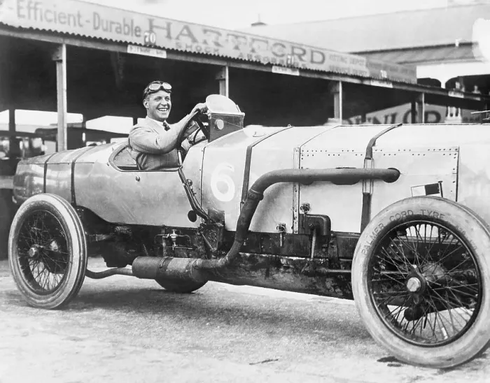 Framed Print : Auto Racer Posing in His Car