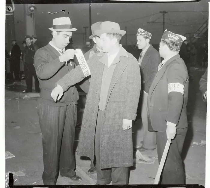 Framed Print : Automobile Employees Getting Fitted with Protest Bands Framed Print : Automobile Employees Getting Fitted with Protest Bands