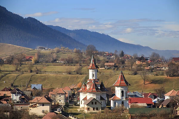 Autumn landscape of village and mountain range in background, Campulung Moldovenesc, Suceava County, Bucovina, Transylvania, Romania