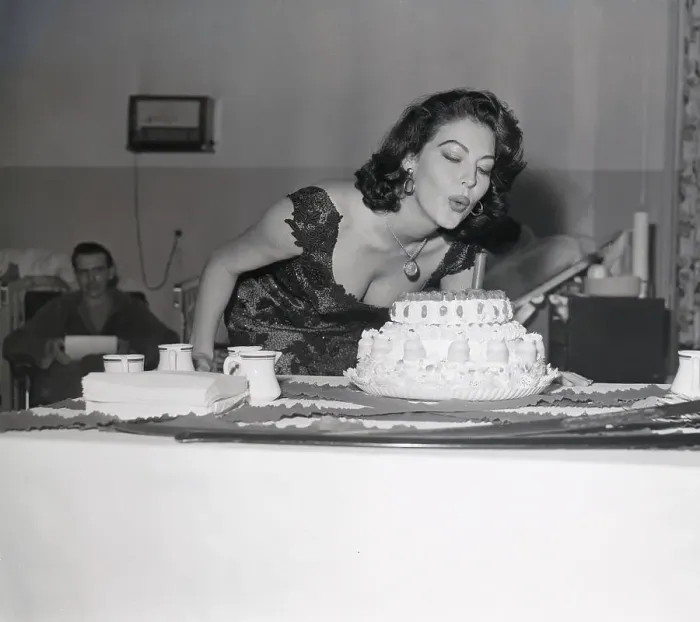 Framed Print : Ava Gardner Blowing out Candle on Birthday Cake Framed Print : Ava Gardner Blowing out Candle on Birthday Cake