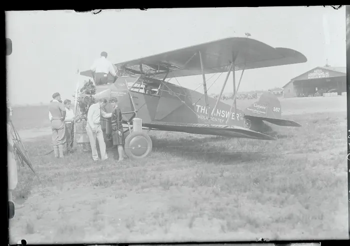 Framed Print : Aviators Beside Aircraft
