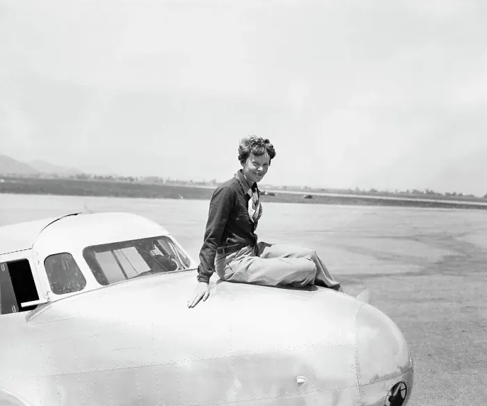 Framed Print : Aviatrix Amelia Earhart Posing on Airplane
