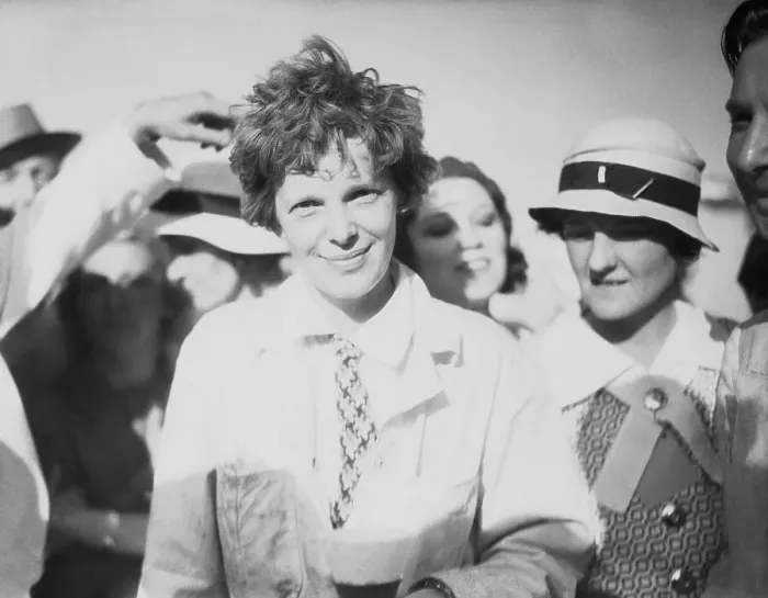Framed Print : Aviatrix Amelia Earhart Smiling at Airfield