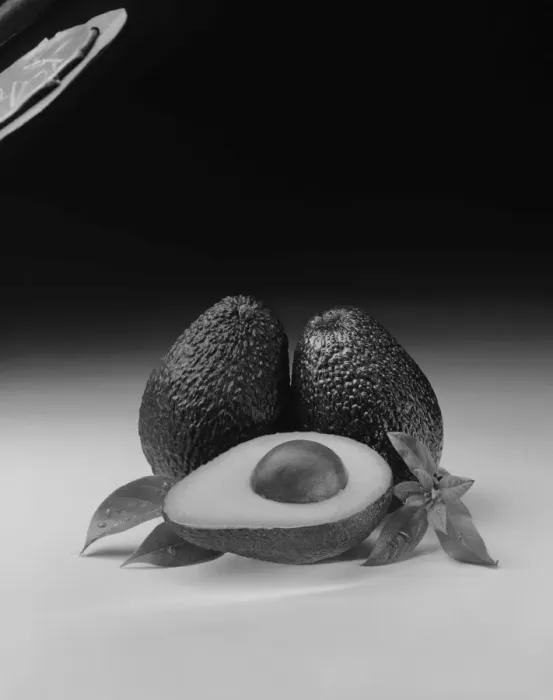 Framed Print : Avocados with leaf on white background, close-up Framed Print : Avocados with leaf on white background, close-up