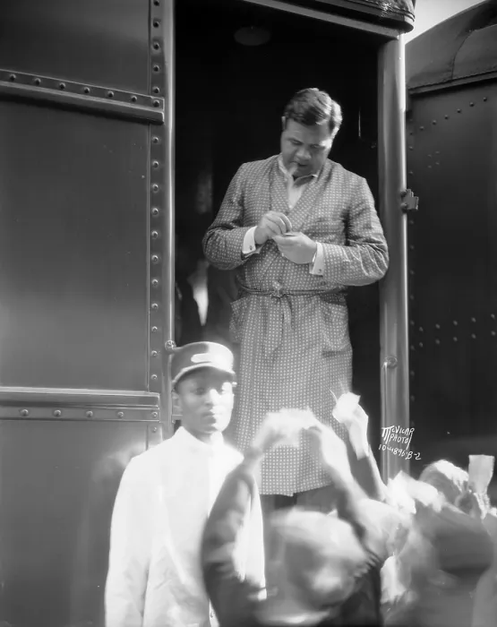 Framed Print : Babe Ruth, wearing dressing gown, stands in the doorway of a train Framed Print : Babe Ruth, wearing dressing gown, stands in the doorway of a train