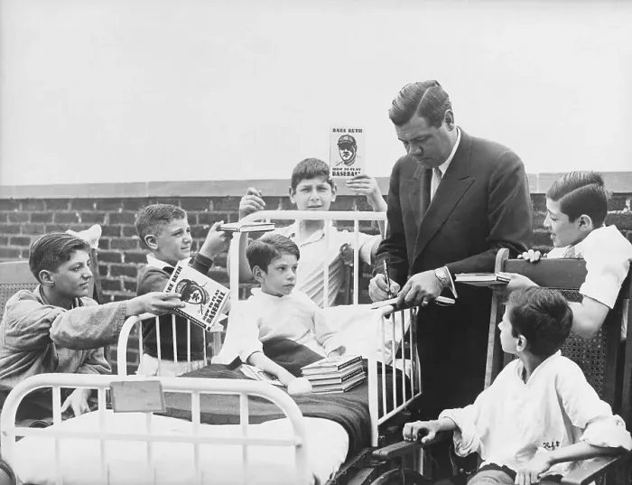 Framed Print : Babe Ruth Signing Books for Sick Children Framed Print : Babe Ruth Signing Books for Sick Children