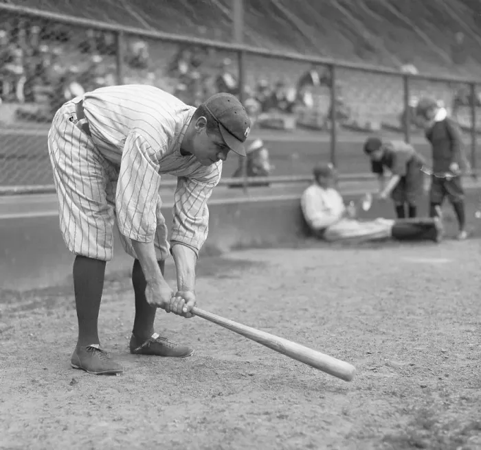 Framed Print : Babe Ruth tapping baseball bat on the ground