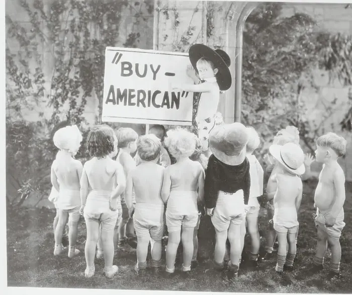 Framed Print : Babies Appearing in Movie with Buy American Sign Framed Print : Babies Appearing in Movie with Buy American Sign