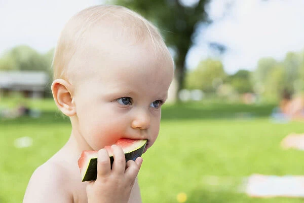 Baby, 12-14 months, eating watermelon