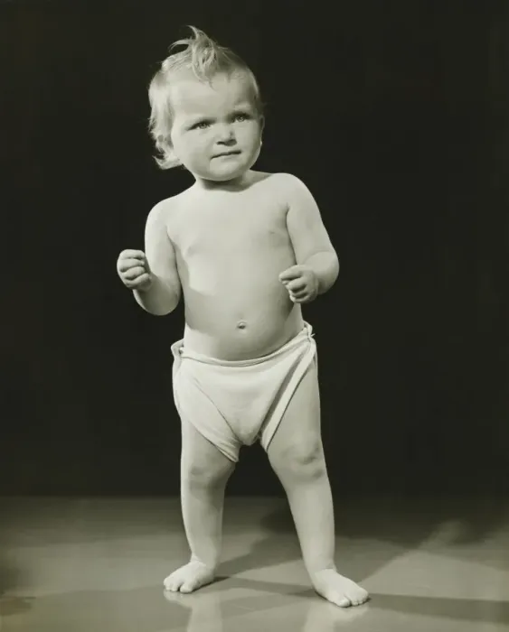 Framed Print : Baby (12-15 months) in diaper standing in studio, (B&W) Framed Print : Baby (12-15 months) in diaper standing in studio, (B&W)