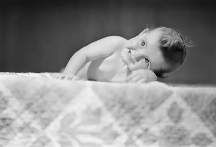 Framed Print : Baby boy (2-5 months) crawling on bed Framed Print : Baby boy (2-5 months) crawling on bed