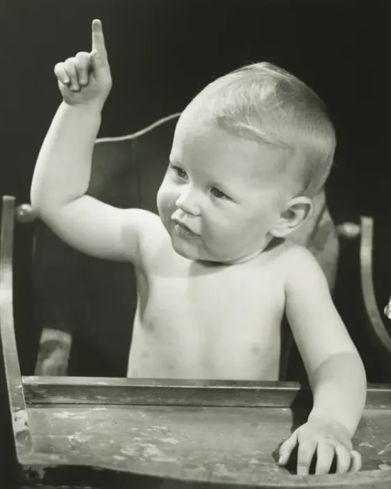 Framed Print : Baby boy (6-12 months) pointing, sitting in high chair, (B&W), portrait Framed Print : Baby boy (6-12 months) pointing, sitting in high chair, (B&W), portrait