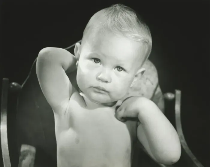 Framed Print : Baby boy (6-12 months) sitting in high chair, (B&W), portrait Framed Print : Baby boy (6-12 months) sitting in high chair, (B&W), portrait