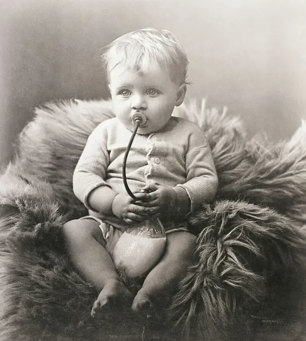 Framed Print : Baby Boy on Bear Rug Sucking on Milk Bottle Framed Print : Baby Boy on Bear Rug Sucking on Milk Bottle