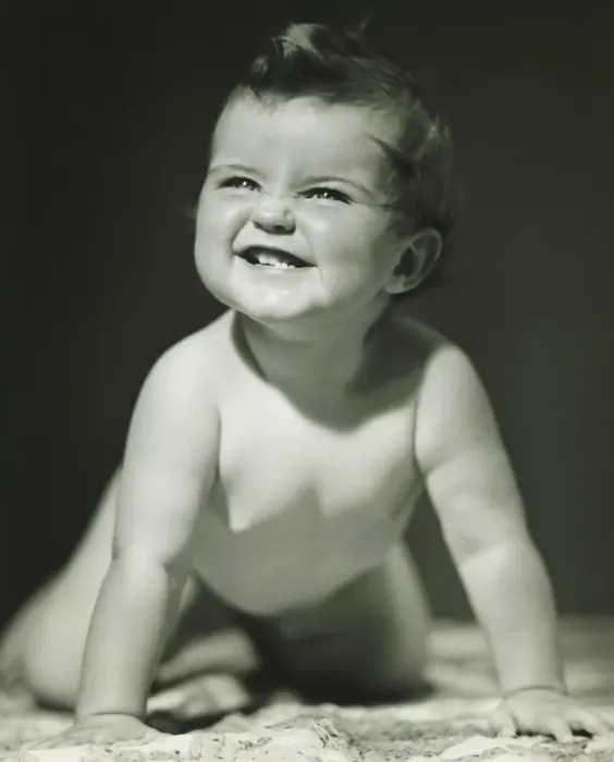 Framed Print : Baby girl (6-9 months) crawling on blanket in studio, (B&W)