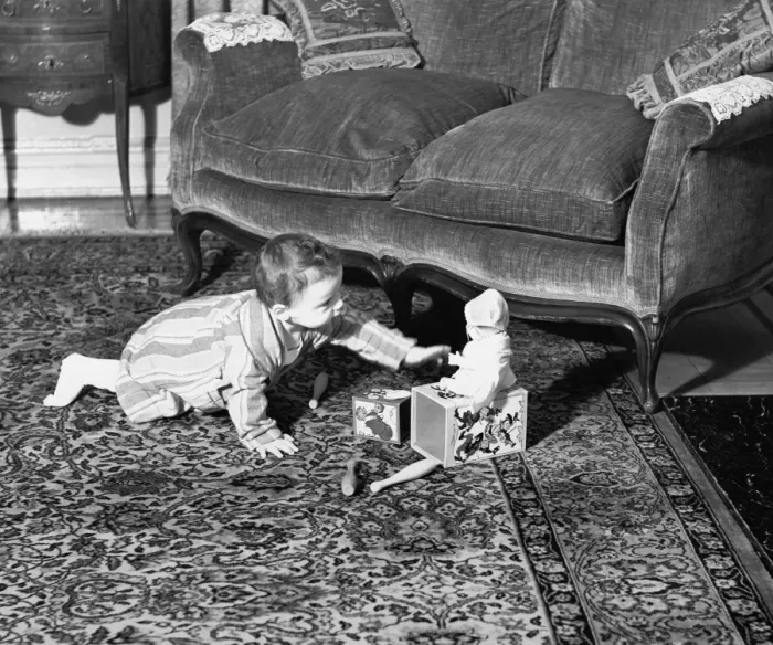 Framed Print : Baby girl (6-9 months) playing on floor, (B&W) Framed Print : Baby girl (6-9 months) playing on floor, (B&W)