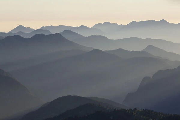 Backlit mountain ridges seen from Hochiss Mountain in Rofan, Maurach, Tyrol, Austria