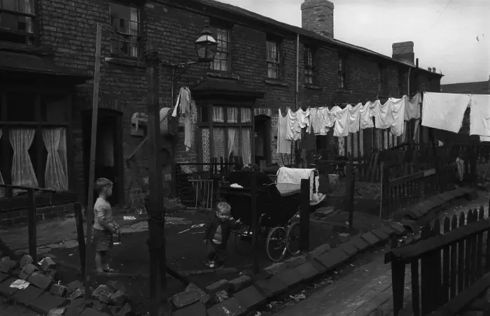 Framed Print : Backyards. 29th October 1956: Children playing in the backyards of slum area housing Framed Print : Backyards. 29th October 1956: Children playing in the backyards of slum area housing