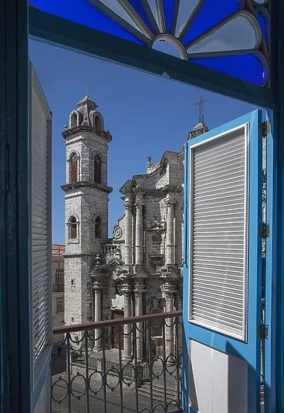 Balcony doors overlooking cityscape, Havana, Cuba