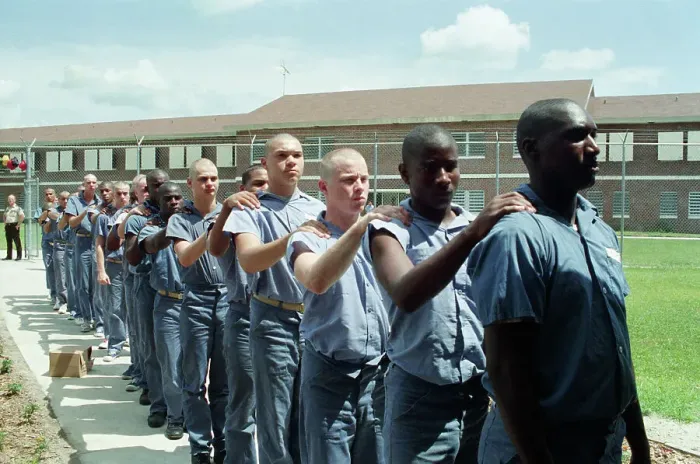 Framed Print : Bald Prison Inmates Marching in Yard Framed Print : Bald Prison Inmates Marching in Yard