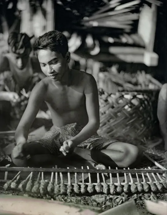 Framed Print : Balinese Man Roasting Turtle Framed Print : Balinese Man Roasting Turtle