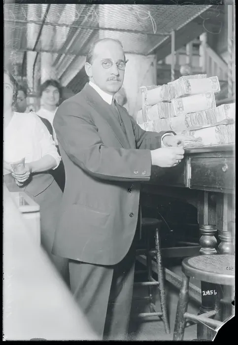 Framed Print : Bank Cashier with Stacks of Bills Framed Print : Bank Cashier with Stacks of Bills