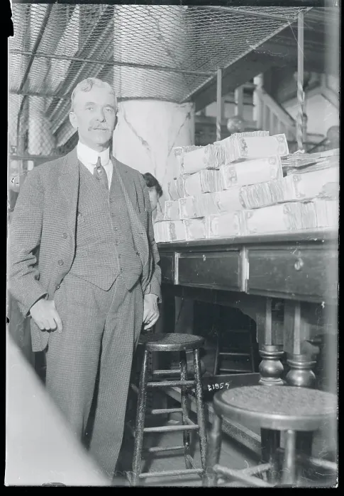 Framed Print : Bank Cashier with Stacks of Bills Framed Print : Bank Cashier with Stacks of Bills