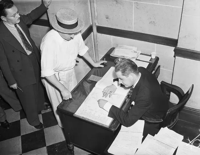 Framed Print : Bank Employee Checks Depositor's Account Framed Print : Bank Employee Checks Depositor's Account