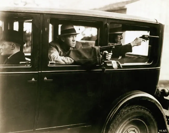 Framed Print : Bank Robbers Shooting from Automobile Framed Print : Bank Robbers Shooting from Automobile