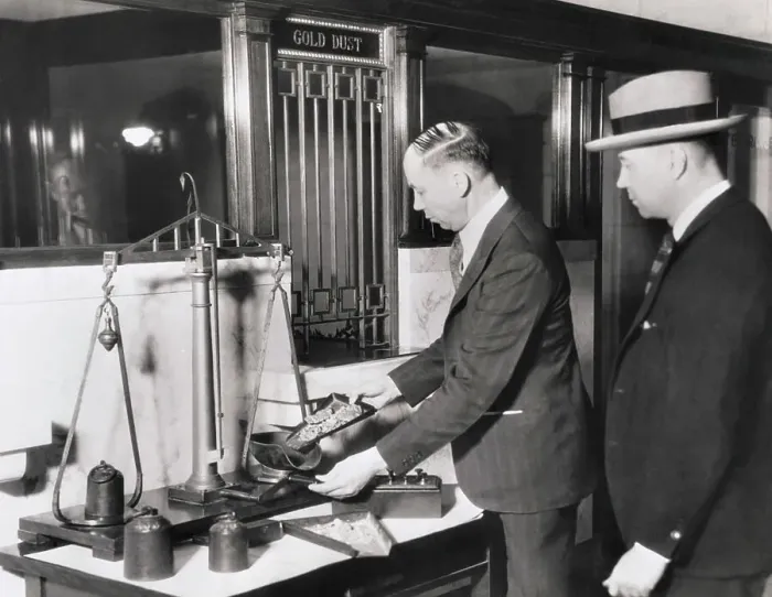 Framed Print : Banker Using Scale to Weigh Gold Framed Print : Banker Using Scale to Weigh Gold