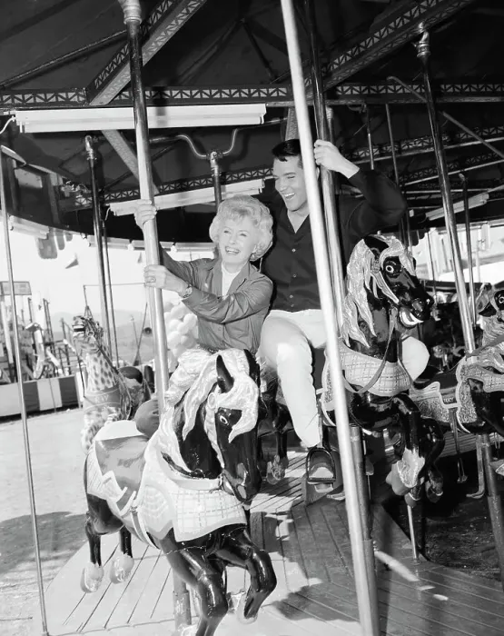 Framed Print : Barbara Stanwyck and Elvis Presley on a Carousel Framed Print : Barbara Stanwyck and Elvis Presley on a Carousel