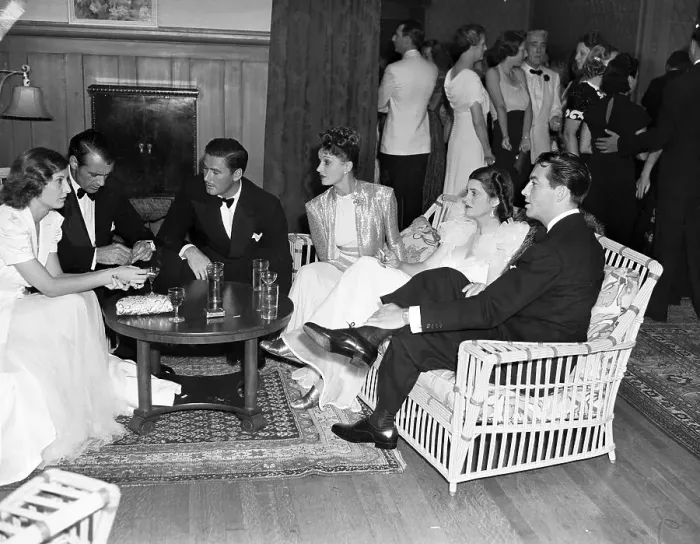 Framed Print : Barbara Stanwyck, Gary Cooper, Errol Flynn, Lili Damita, Mrs. Gary Cooper, and Robert Taylor Chatting Framed Print : Barbara Stanwyck, Gary Cooper, Errol Flynn, Lili Damita, Mrs. Gary Cooper, and Robert Taylor Chatting