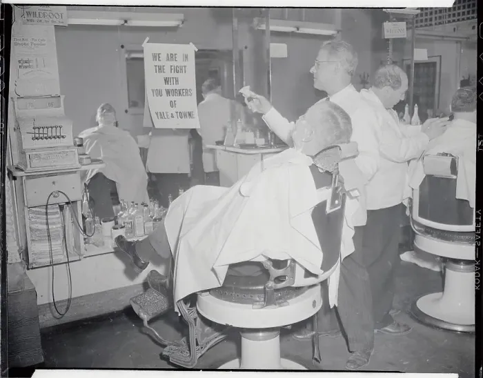 Framed Print : Barber Showing Support for Strikers to Customer Framed Print : Barber Showing Support for Strikers to Customer