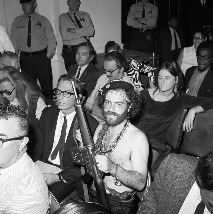 Framed Print : Bare Chested Jerry Rubin with Toy Gun Framed Print : Bare Chested Jerry Rubin with Toy Gun