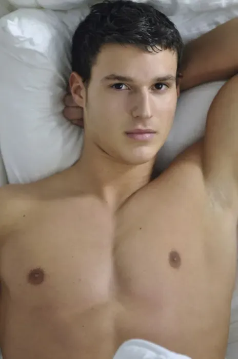 Framed Print : Bare-chested young man lying in bed Framed Print : Bare-chested young man lying in bed