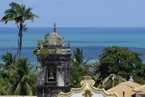 Baroque church, palm trees and blue ocean, Olinda, Pernambuco, Brazil