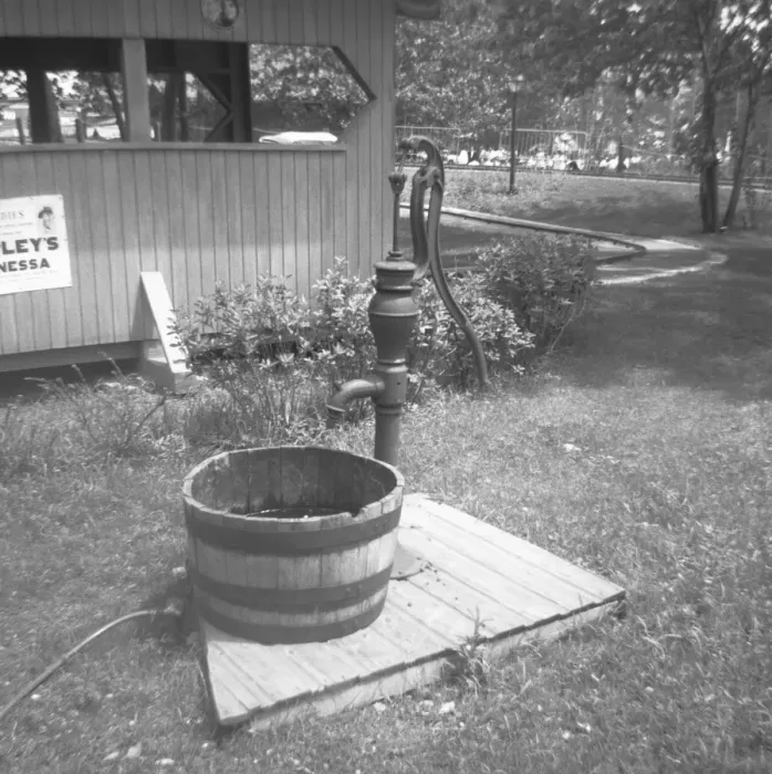 Framed Print : Barrel at water pump in garden, (B&W) Framed Print : Barrel at water pump in garden, (B&W)