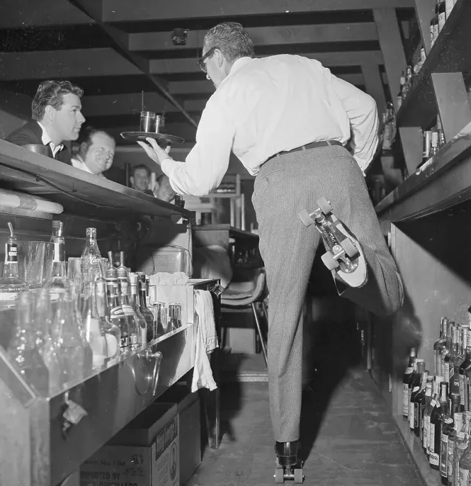 Framed Print : Bartender Serving Drinks on Roller Skates Framed Print : Bartender Serving Drinks on Roller Skates