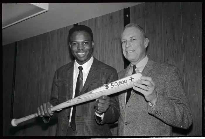 Framed Print : Baseball Player and Manager Holding Bat Framed Print : Baseball Player and Manager Holding Bat