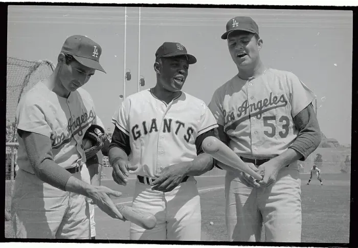 Framed Print : Baseball Players Discussing Baseball Bats Framed Print : Baseball Players Discussing Baseball Bats