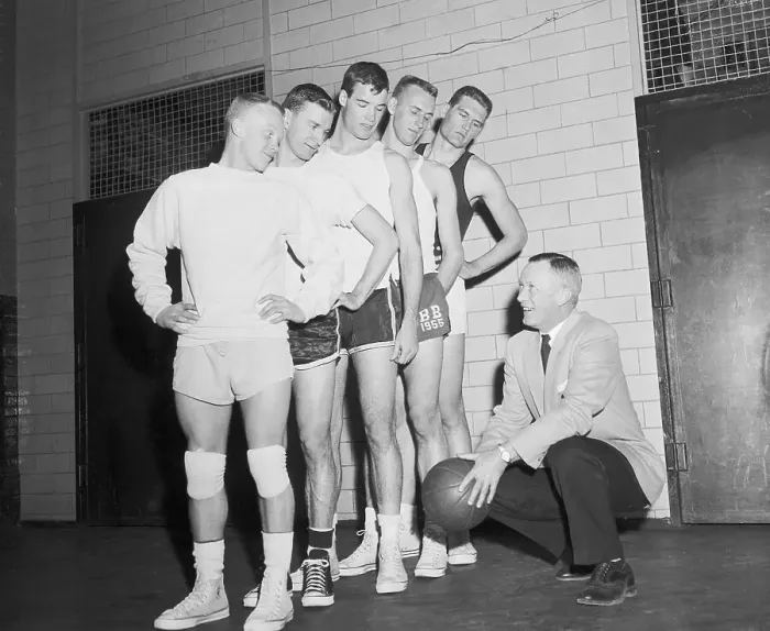 Framed Print : Basketball Players Standing Above Their Coach Framed Print : Basketball Players Standing Above Their Coach