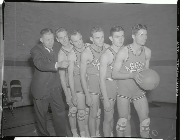 Framed Print : Basketball Teammates and Coach Posing with Ball Framed Print : Basketball Teammates and Coach Posing with Ball