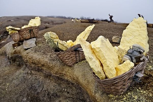 Baskets full of sulfur stone with mask