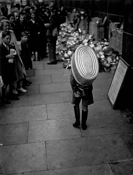 Bath Boy. A little boy carries a bath to the salvage dump in Chelsea, London