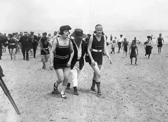 Framed Print : Bathers Being Escorted from Beach