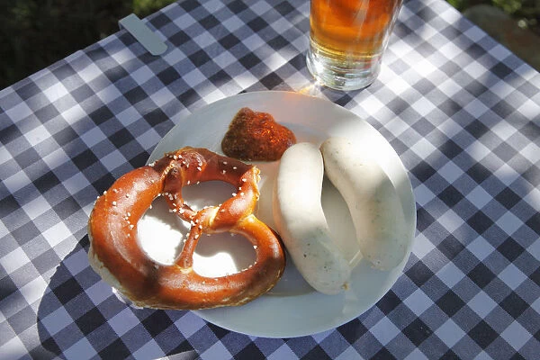 Bavarian Weisswurst veal sausages and pretzels, Upper Bavaria, Bavaria, Germany, Europe