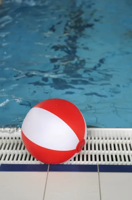Framed Print : Beach ball at the edge of a swimming pool Framed Print : Beach ball at the edge of a swimming pool