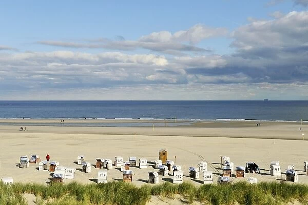 Beach with chair beach, North Sea with a cloudy sky, Spiekeroog, East Frisia, Lower Saxony, Germany